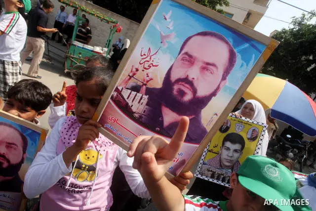 Palestinians gather during a protest in front of the Red Cross' offices in Gaza City to calling of release of palestinian prisoners on June, 25, 2012. Photo by Ashraf Amra