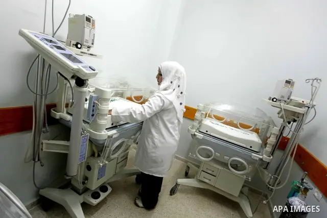 Palestinian doctors take part in the opening of the Al Harazin hospital generation in Gaza City on June, 25, 2012. Photo by Ashraf Amra.