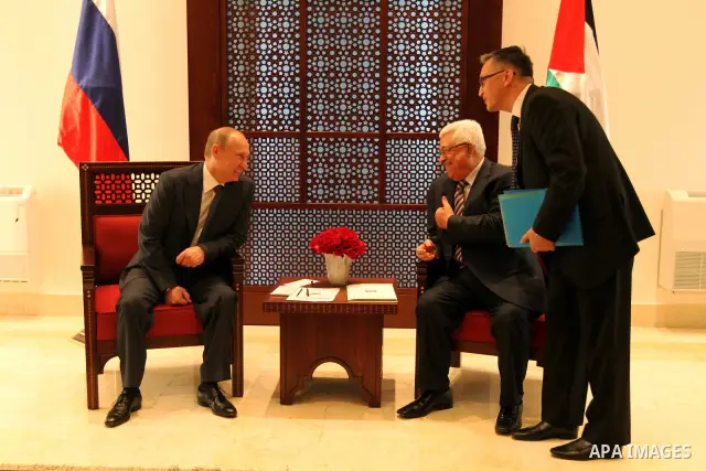Palestinian President Mahmoud Abbas meets with his Russian counterpart Vladimir Putin at his office in the West Bank city of Bethlehem on June 26, 2012./Pool/Luay Sababa