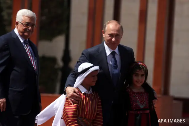 Palestinian President Mahmoud Abbas meets with his Russian counterpart Vladimir Putin at his office in the West Bank city of Bethlehem on June 26, 2012. photo by Issam Rimawi