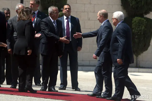 Palestinian President Mahmoud Abbas meets with his Russian counterpart Vladimir Putin at his office in the West Bank city of Bethlehem on June 26, 2012. photo by Issam Rimawi