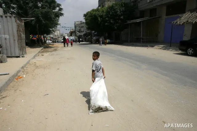A Palestinian child walks in the streets Rafah, southern Gaza Strip on June 26, 2012. The European Union's envoy to the Palestinian Authority confirmed its support and allegiance to the people. Photo by Eyad Al Baba .