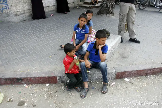 Palestinian children sit in the streets Rafah, southern Gaza Strip on June 26, 2012. The European Union's envoy to the Palestinian Authority confirmed its support and allegiance to the people. Photo by Eyad Al Baba .