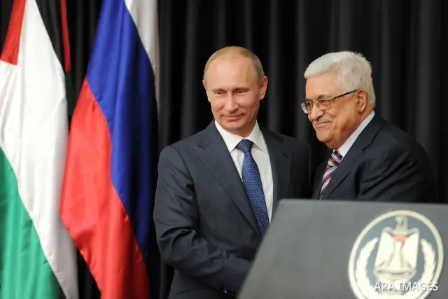 Palestinian President Mahmoud Abbas meets with his Russian counterpart Vladimir Putin at his office in the West Bank city of Bethlehem on June 26, 2012. Photo by Thaer Ganaim