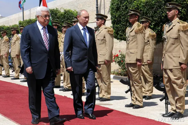 Palestinian President Mahmoud Abbas meets with his Russian counterpart Vladimir Putin at his office in the West Bank city of Bethlehem on June 26, 2012. Photo by Thaer Ganaim