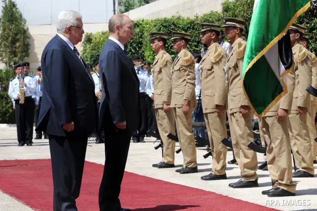 Palestinian President Mahmoud Abbas meets with his Russian counterpart Vladimir Putin at his office in the West Bank city of Bethlehem on June 26, 2012. Photo by Thaer Ganaim