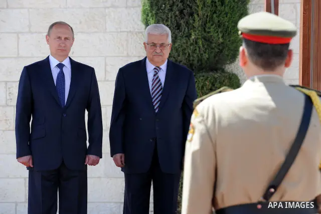 Palestinian President Mahmoud Abbas meets with his Russian counterpart Vladimir Putin at his office in the West Bank city of Bethlehem on June 26, 2012. Photo by Thaer Ganaim