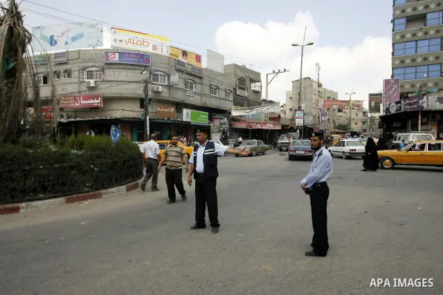 Palestinian policemen organize the traffic,in the southern Gaza Strip town of Rafah, on June 26, 2012. Photo by Eyad Al Baba .
