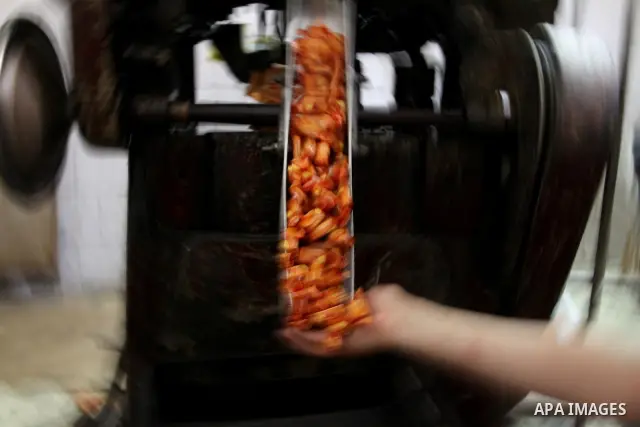Palestinian labourers work at a factory for making a kind of candy " Toffee" in the West Bank city of Nablus on July 26, 2012. Photo by Nedal Eshtayah