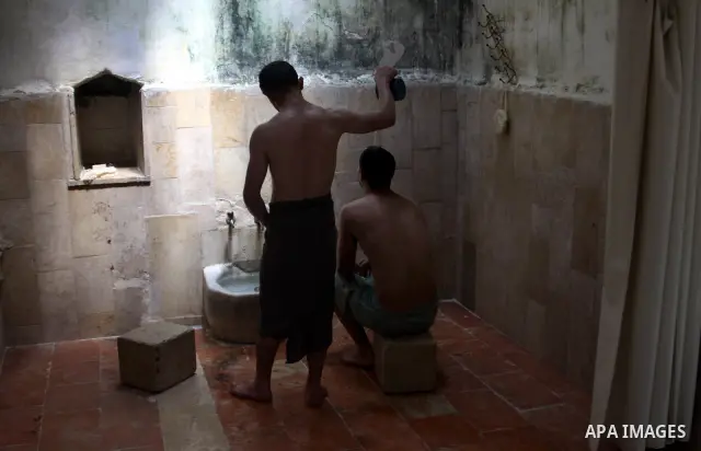Palestinians enjoy steam bath at the 400-year-old traditional Turkish bath ''Hamam Al shefa'' in the West Bank City of Nablus on June 27, 2012. Photo by Nedal Eshtayah