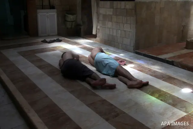 Palestinians enjoy steam bath at the 400-year-old traditional Turkish bath ''Hamam Al shefa'' in the West Bank City of Nablus on June 27, 2012. Photo by Nedal Eshtayah
