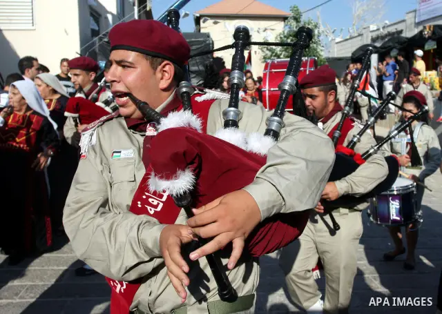Palestinians play folk music as they take part in a Palestinian wedding, during the opening of the "Heritage Week V in Birzeit 2012" in the old town of Birzeit in Ramallah, West Bank, 27 June 2012. Photo by Issam Rimawi