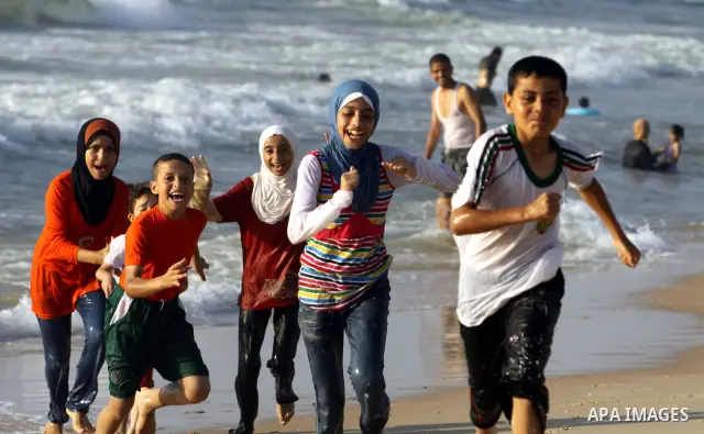 Palestinian children play at Gaza's beach on 27 June 2012 in Gaza . Photo by Majdi Fathi