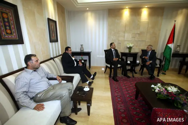 Palestinian Prime Minister Salam Fayyad meets with Emirates Union of Football delegation, in the West Bank city of Ramallah on June 28, 2012. Photo by Mustafa Abu Dayah