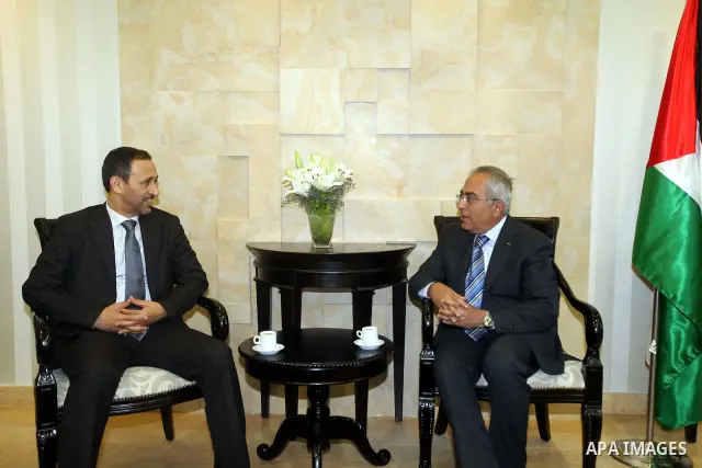 Palestinian Prime Minister Salam Fayyad meets with Emirates Union of Football delegation, in the West Bank city of Ramallah on June 28, 2012. Photo by Mustafa Abu Dayah