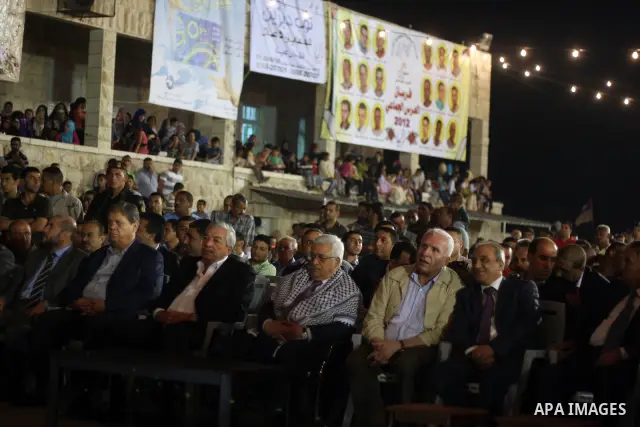 Palestinian President Mahmoud Abbas attends a mass wedding for 19 Groom in the village of Silwad in the West Bank city of Ramallah, June 28, 2012. Photo by Issam Rimawi
