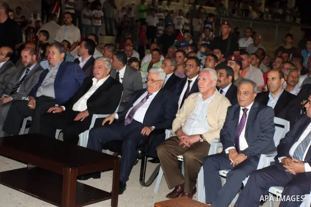 Palestinian President Mahmoud Abbas attends a mass wedding for 19 Groom in the village of Silwad in the West Bank city of Ramallah, June 28, 2012. Photo by Issam Rimawi