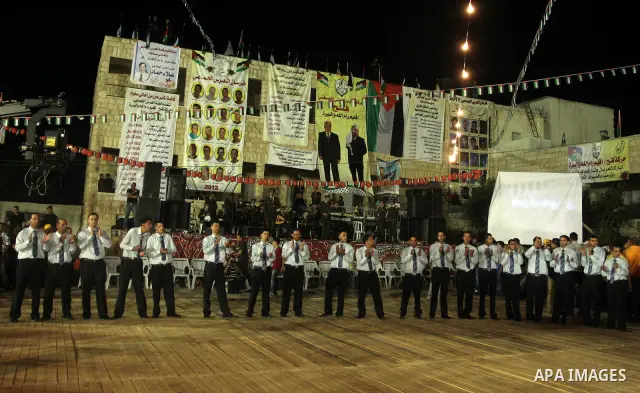 Palestinians celebrate during a mass wedding for 19 Groom, participation of Palestinian President Mahmoud Abbas (not seen) in the village of Silwad in the West Bank city of Ramallah, June 28, 2012. Photo by Issam Rimawi