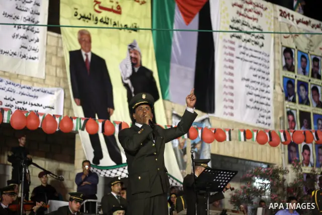 Palestinians celebrate during a mass wedding for 19 Groom, participation of Palestinian President Mahmoud Abbas (not seen) in the village of Silwad in the West Bank city of Ramallah, June 28, 2012. Photo by Issam Rimawi