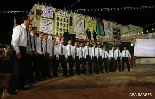 Palestinians celebrate during a mass wedding for 19 Groom, participation of Palestinian President Mahmoud Abbas (not seen) in the village of Silwad in the West Bank city of Ramallah, June 28, 2012. Photo by Issam Rimawi