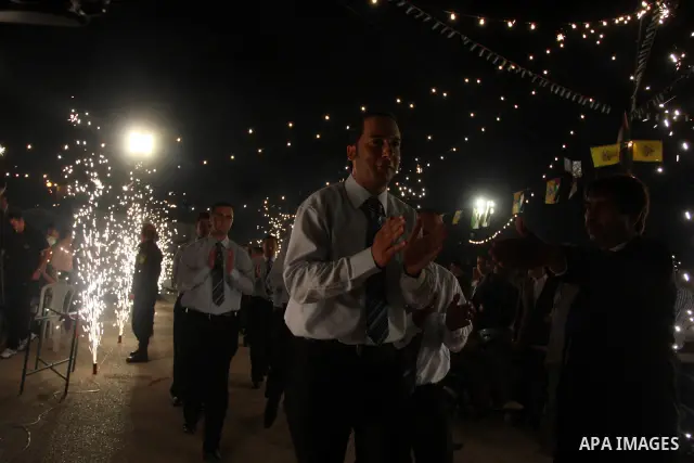 Palestinians celebrate during a mass wedding for 19 Groom, participation of Palestinian President Mahmoud Abbas (not seen) in the village of Silwad in the West Bank city of Ramallah, June 28, 2012. Photo by Issam Rimawi