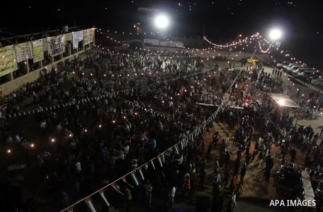 Palestinians celebrate during a mass wedding for 19 Groom, participation of Palestinian President Mahmoud Abbas (not seen) in the village of Silwad in the West Bank city of Ramallah, June 28, 2012. Photo by Issam Rimawi