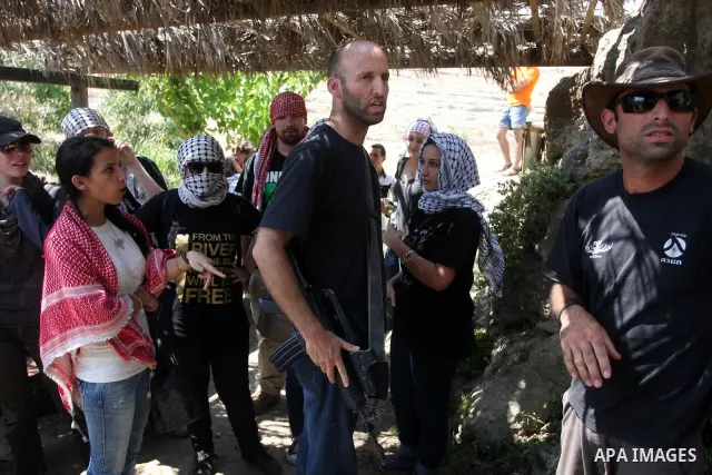 Israeli soldiers confront Palestinian protesters during a demonstration against Israel's separation barrier in the West Bank village of Nabi Saleh near Ramallah, Friday, June 29, 2012. Palestinians protest weekly against...