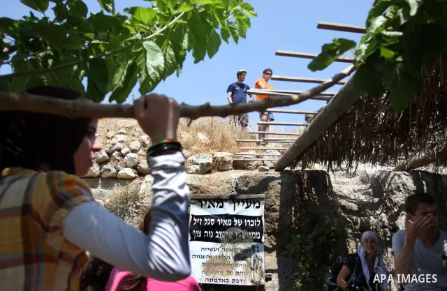 Jewish settlers confront Palestinian protesters during a demonstration against Israel's separation barrier in the West Bank village of Nabi Saleh near Ramallah, Friday, June 29, 2012. Palestinians protest weekly against...