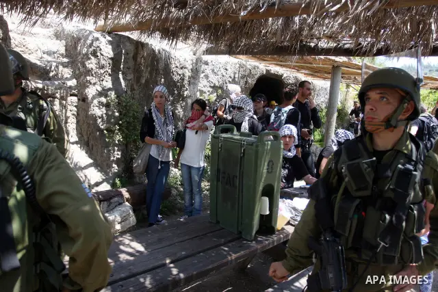 Israeli soldiers confront Palestinian protesters during a demonstration against Israel's separation barrier in the West Bank village of Nabi Saleh near Ramallah, Friday, June 29, 2012. Palestinians protest weekly against...
