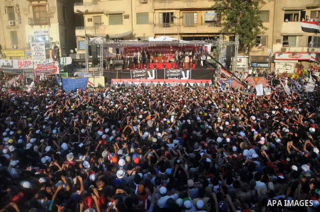 Egyptians listen to Egyptian President-elect Mohamed Morsi's speech in Tahrir square, Cairo, Egypt, 29 June 2012. Media reports stated Morsi said on 29 June that people power was the basis of his authority as the country...