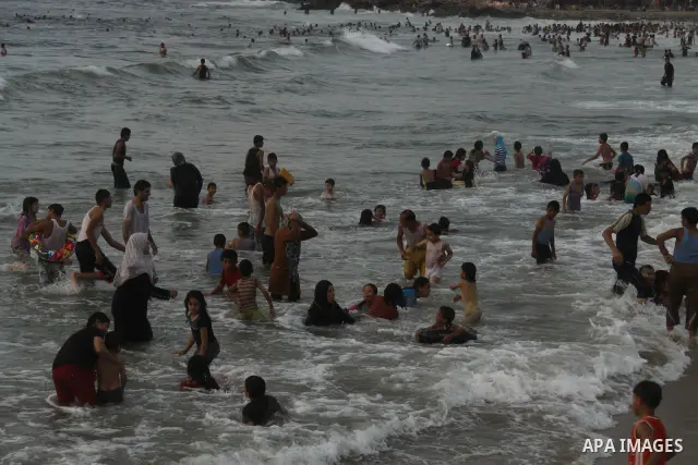 Palestinians enjoy swimming on their week-end in the Mediterranean sea in Gaza City on June 29, 2012. Photo by Majdi Fathi