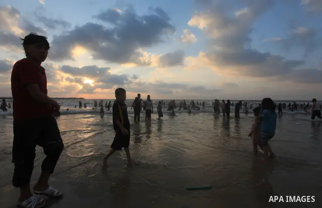 Palestinians enjoy swimming on their week-end in the Mediterranean sea in Gaza City on June 29, 2012. Photo by Majdi Fathi