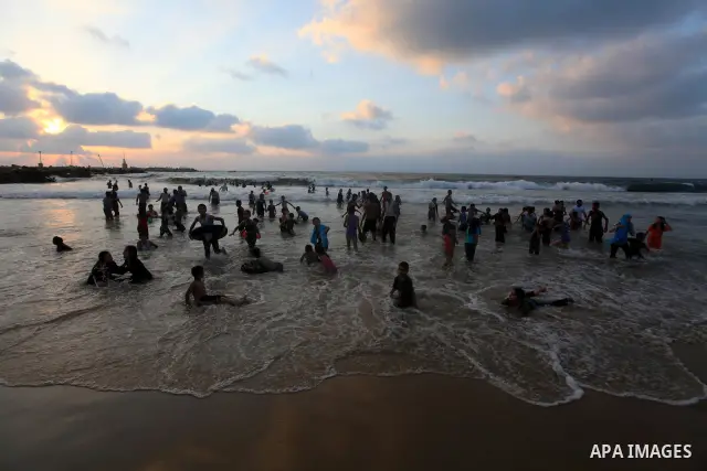Palestinians enjoy swimming on their week-end in the Mediterranean sea in Gaza City on June 29, 2012. Photo by Majdi Fathi