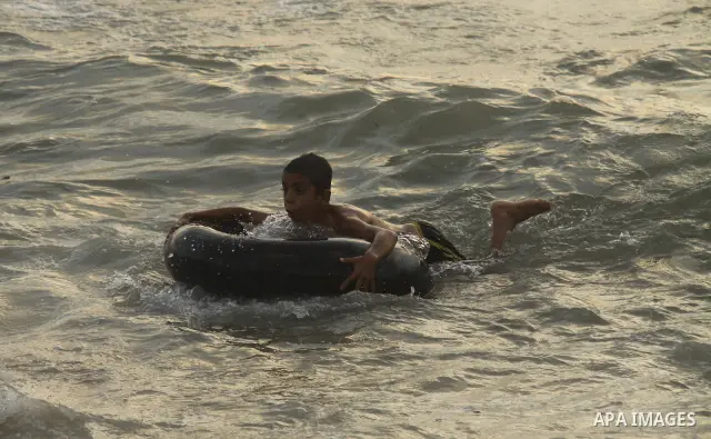 Palestinians enjoy swimming on their week-end in the Mediterranean sea in Gaza City on June 29, 2012. Photo by Majdi Fathi