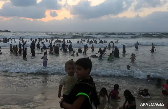 Palestinians enjoy swimming on their week-end in the Mediterranean sea in Gaza City on June 29, 2012. Photo by Majdi Fathi