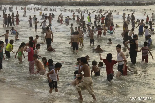 Palestinians enjoy swimming on their week-end in the Mediterranean sea in Gaza City on June 29, 2012. Photo by Majdi Fathi