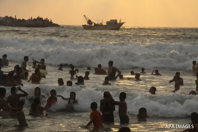 Palestinians enjoy swimming on their week-end in the Mediterranean sea in Gaza City on June 29, 2012. Photo by Majdi Fathi