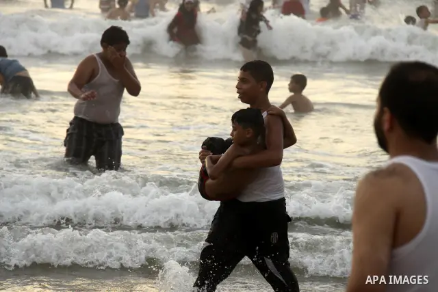 Palestinians enjoy swimming on their week-end in the Mediterranean sea in Gaza City on June 29, 2012. Photo by Majdi Fathi
