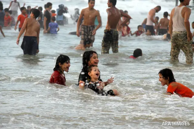 Palestinians enjoy swimming on their week-end in the Mediterranean sea in Gaza City on June 29, 2012. Photo by Majdi Fathi