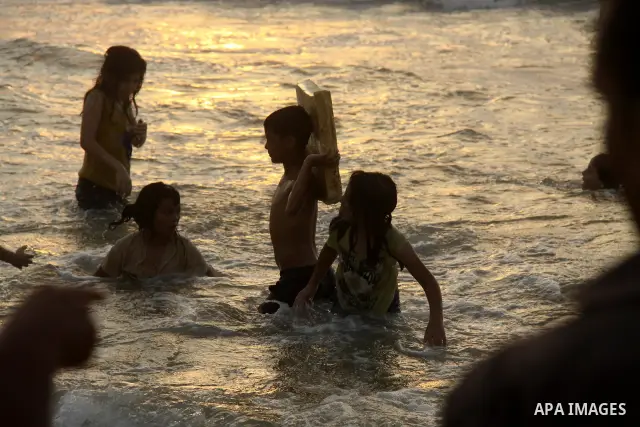 Palestinians enjoy swimming on their week-end in the Mediterranean sea in Gaza City on June 29, 2012. Photo by Majdi Fathi