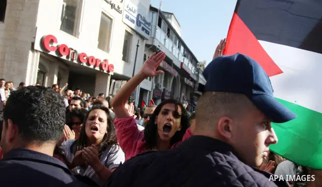 Palestinian police control the crowd in the West Bank city of Ramallah, on June 30, 2012, during a protest against a planned meeting between Palestinian leader Mahmud Abbas and Israel's vice prime minister Shaul Mofaz. T...