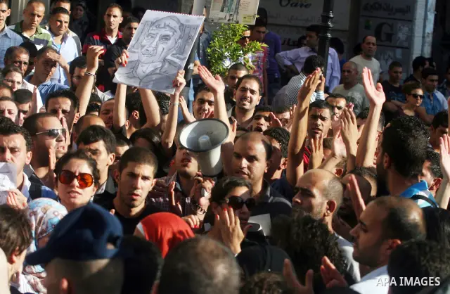 Palestinian police control the crowd in the West Bank city of Ramallah, on June 30, 2012, during a protest against a planned meeting between Palestinian leader Mahmud Abbas and Israel's vice prime minister Shaul Mofaz. T...