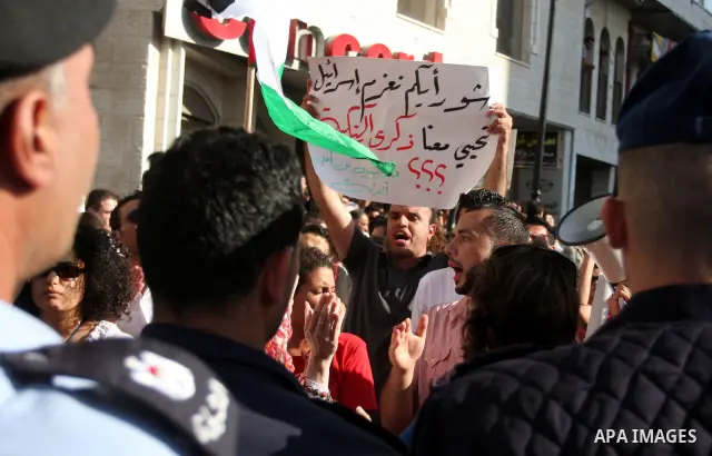 Palestinian police control the crowd in the West Bank city of Ramallah, on June 30, 2012, during a protest against a planned meeting between Palestinian leader Mahmud Abbas and Israel's vice prime minister Shaul Mofaz. T...