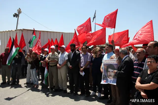 A Democratic Front for the Liberation of Palestine (DFLP) demonstration supporting prisoners in Israeli jails outside the Ofer military prison, near the West Bank city of Ramallah, Sunday, July, 1, 2012.. Photo by Issam...