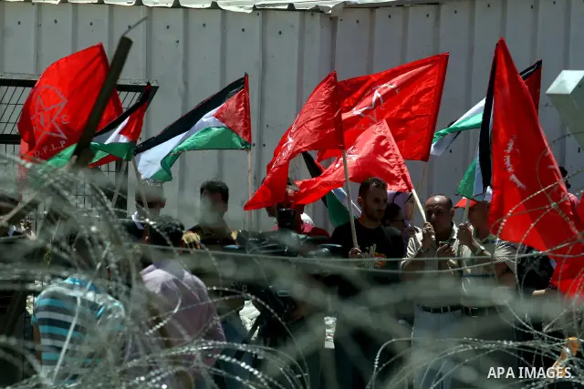 A Democratic Front for the Liberation of Palestine (DFLP) demonstration supporting prisoners in Israeli jails outside the Ofer military prison, near the West Bank city of Ramallah, Sunday, July, 1, 2012.. Photo by Issam...