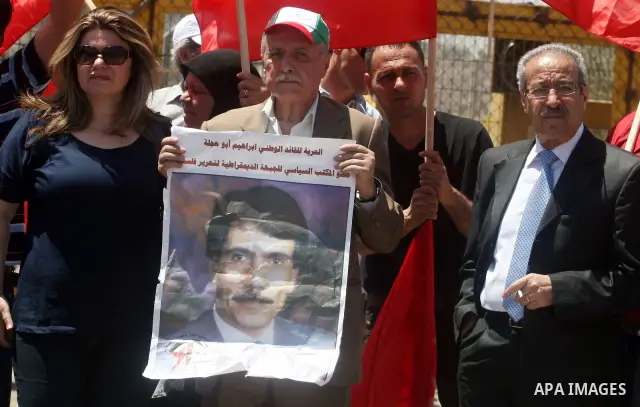 A Democratic Front for the Liberation of Palestine (DFLP) demonstration supporting prisoners in Israeli jails outside the Ofer military prison, near the West Bank city of Ramallah, Sunday, July, 1, 2012.. Photo by Issam...