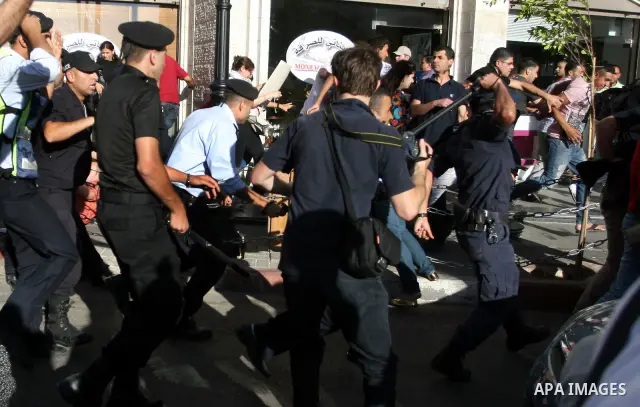 Palestinian Policemen block protesters from reaching the Palestinian presidential headquarters in the West Bank city of Ramallah, during a protest in the town, on 01 July 2012. Demonstrators protested against a scheduled...