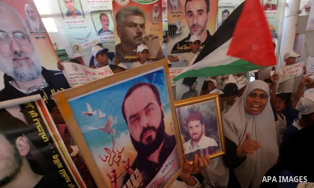 Palestinians gather during a protest in front of the Red Cross' offices in Gaza City to calling of release of palestinian prisoners on July, 02, 2012. Photo by Majdi Fathi