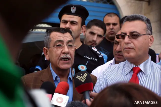 Palestinian Interior Minister Saied Abu Ali speaks during the Journalists protest outside the office of the Palestinian Interior Ministry against the assault by Palestinian police during their coverage of the Palestinian...