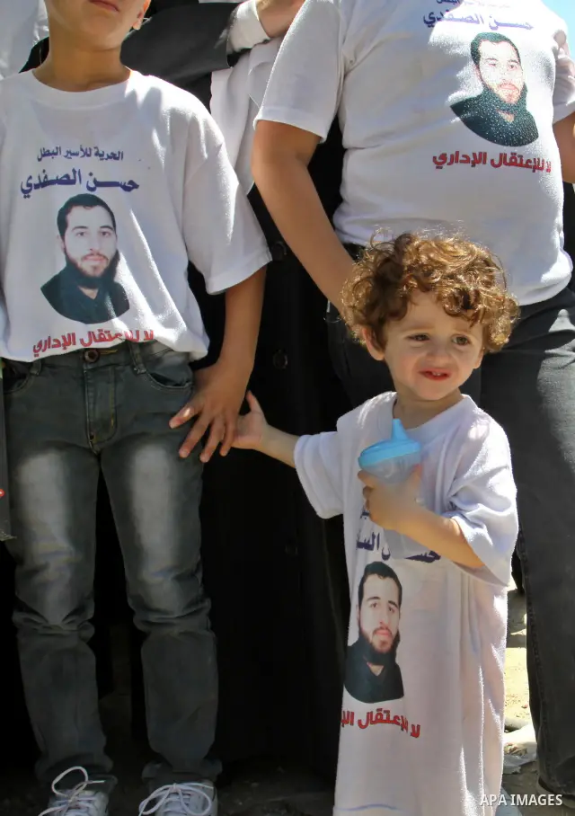 Palestinians gather during a protest in front of the Red Cross' offices in West Bank city of Nablus calling of release of palestinian prisoners on July, 04, 2012. Photo by Nedal Eshtayah